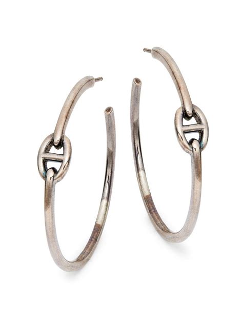 white hermes ring|Hermes silver hoop earrings.